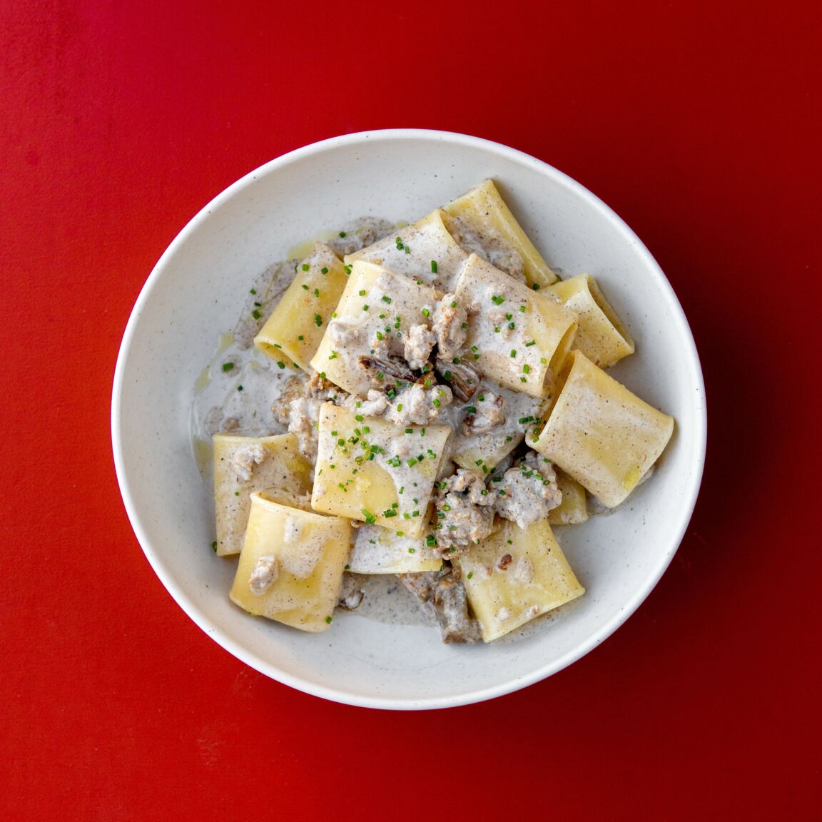 Паккери с сальсиччей, грибами и трюфельным соусом